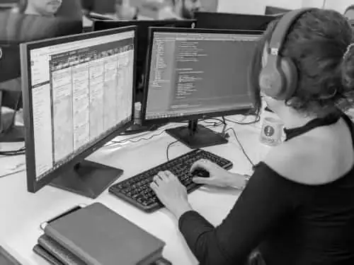 Aparg engineer writing code at a workstation